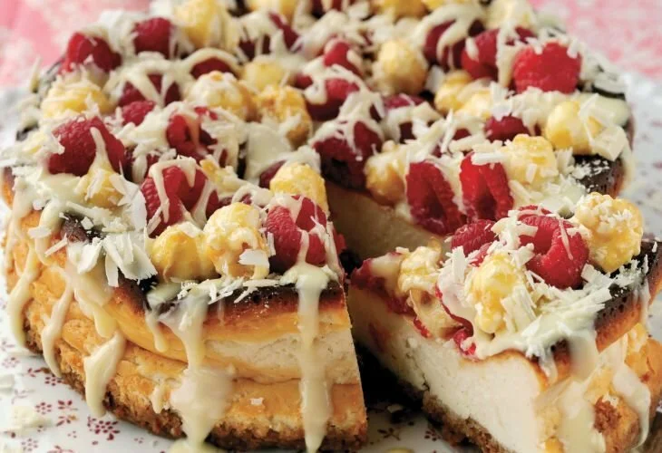 Baked Cheesecake with Raspberries, Popcorn and White Chocolate Sauce Recipe: Cook Vegetarian Magazine